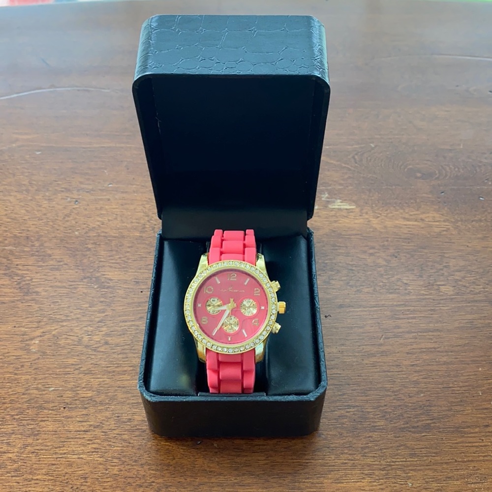 Women’s coral and gold watch